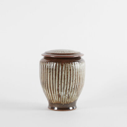 A Peter Stichbury Stoneware Lidded Jar With Tenmoku Glaze