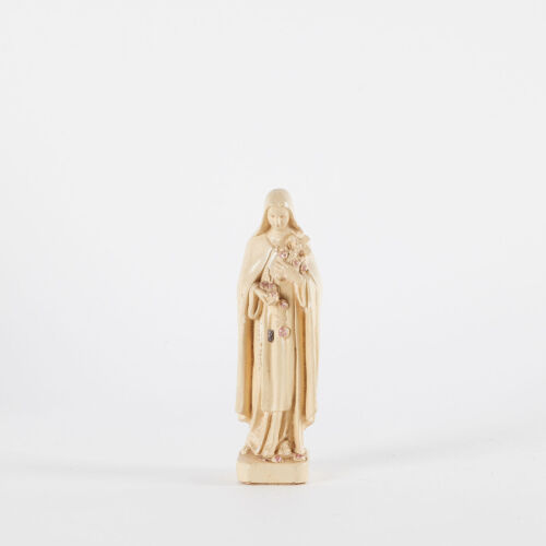 A Small Statue Of Virgin Mary