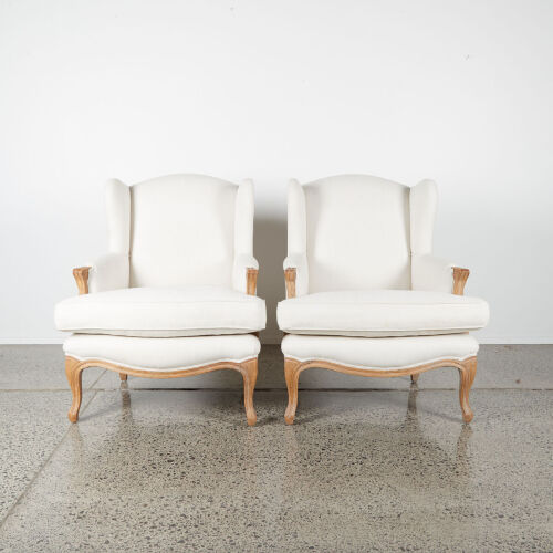 A Pair Of Winged-Backed Occasional Chairs