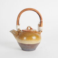 A Ceramic Teapot with Bamboo Handle