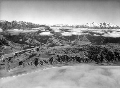 UNKNOWN PHOTOGRAPHER An aerial view of Kaikoura Coast north of Clarence River. Mt. Tapuaenuku [sic] in the distance. New Zealand.