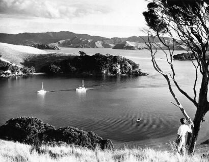 UNKNOWN PHOTOGRAPHER FOR SYDNEY MORNING HERALD Fishing vessels returning over the calm waters of Otehei Bay