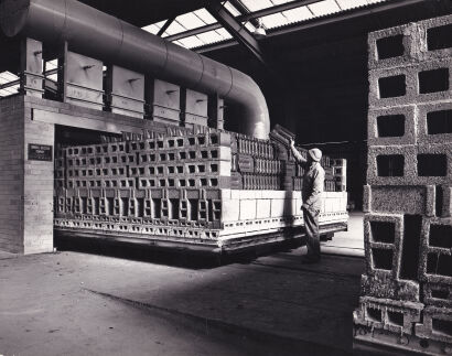 MAX DUPAIN Tiles being stacked for baking in the new tunnel kiln installed at Wunderlich's Rosehill plant