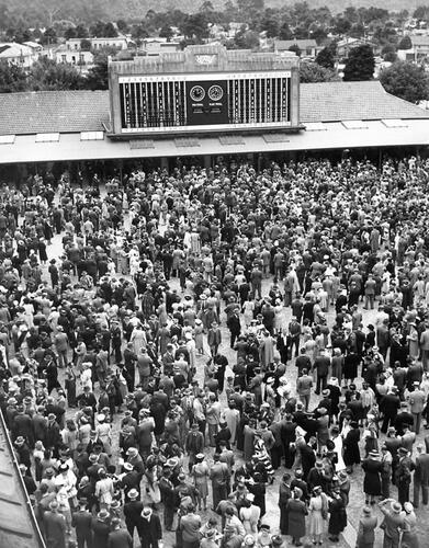 UNKNOWN PHOTOGRAPHER Crowd at Trentham racecourse tote, Wellington.