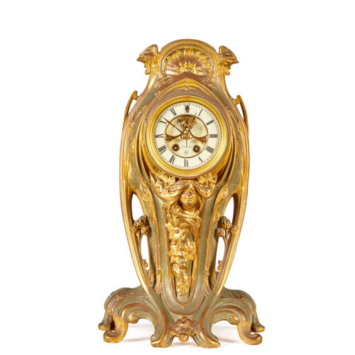 An Art Nouveau Gilt Brass and Painted Clock