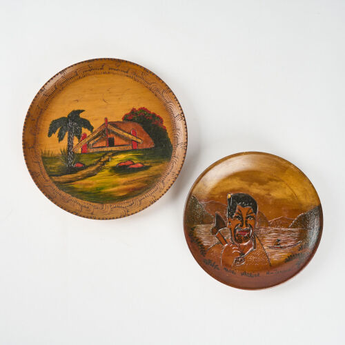 A Pair Of Pokerworked And Painted Plates