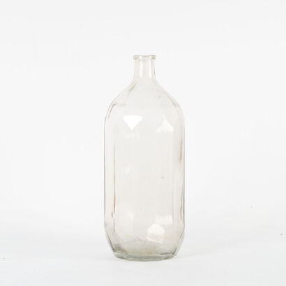 An Extra Large Glass Faceted Bottle