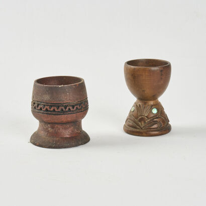 Pair Of Carved Egg Cups With Paua Inserts