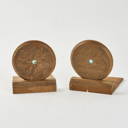 A Pair Of Carved Bookends With Paua Inserts