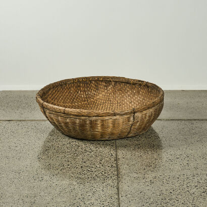 A Large Woven Floor Basket