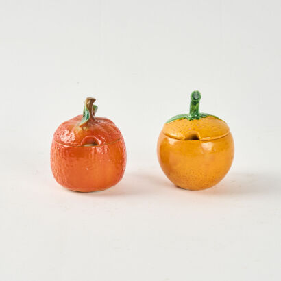 A Pair Of Ceramic Orange Condiment Pots