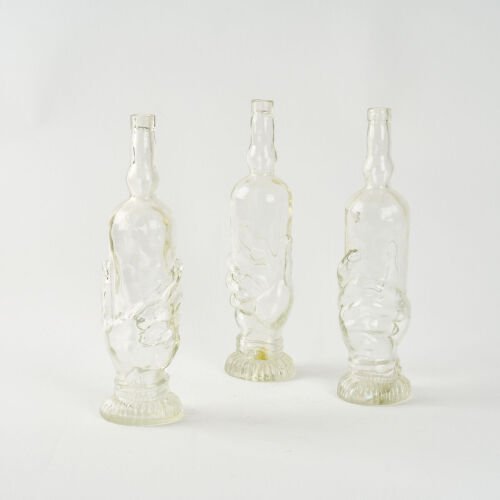 A Set of Three Hand-Shaped Bottles