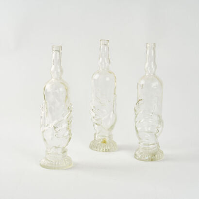 A Set of Three Hand-Shaped Bottles