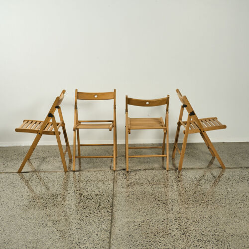 A Set of Four Folding Chairs in Solid Beech