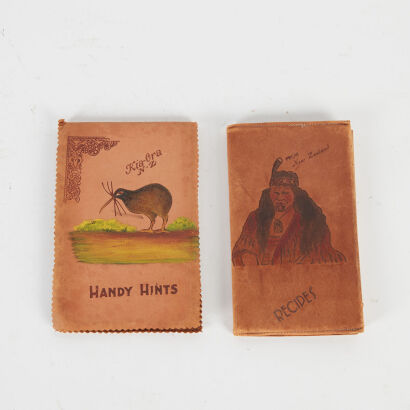 A Pair Of Souvenirware Leather Covered Books