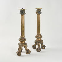 A Pair Of Large Claw Footed Brass Candlesticks