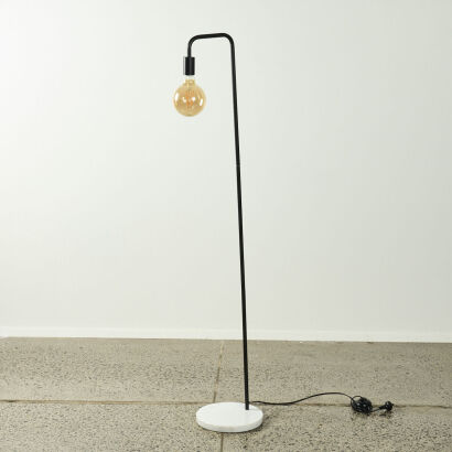 A Contemporary Black Floor Standing Lamp With Edison Bulb