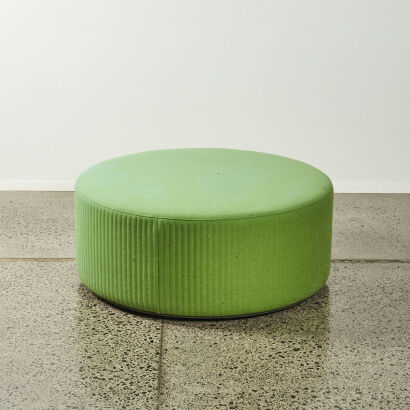 A Large Circular Ottoman In Green Upholstery