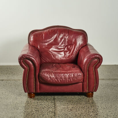 A Large Red Leather Studded Armchair