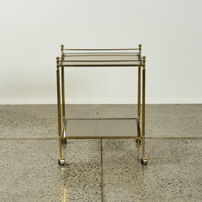 An Elegant Brass And Smoked Glass Regency Drinks Trolley