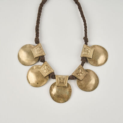 A Metal Disk on Brown Rope Costume Necklace