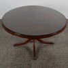 A Circular Mahogany Table With A Glass Overlay - 2