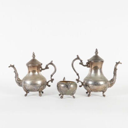 A Pair Of Large Silver Plated F.B. Rogers Teapots And Milk Jug