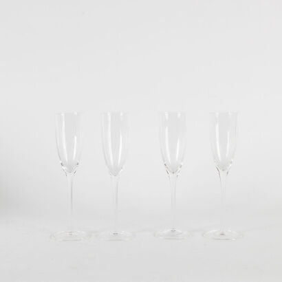 A Set Of Four Tall Chrystal Champagne Flutes