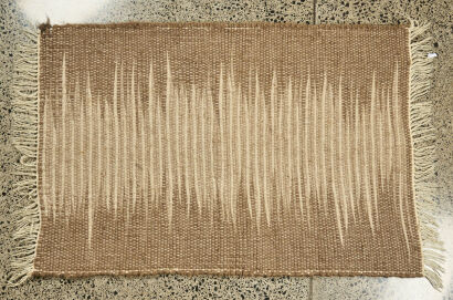 A Handcrafted Natural Wool Woven Rug