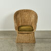 A Mid Century Wicker Chair With Boucle Cushion