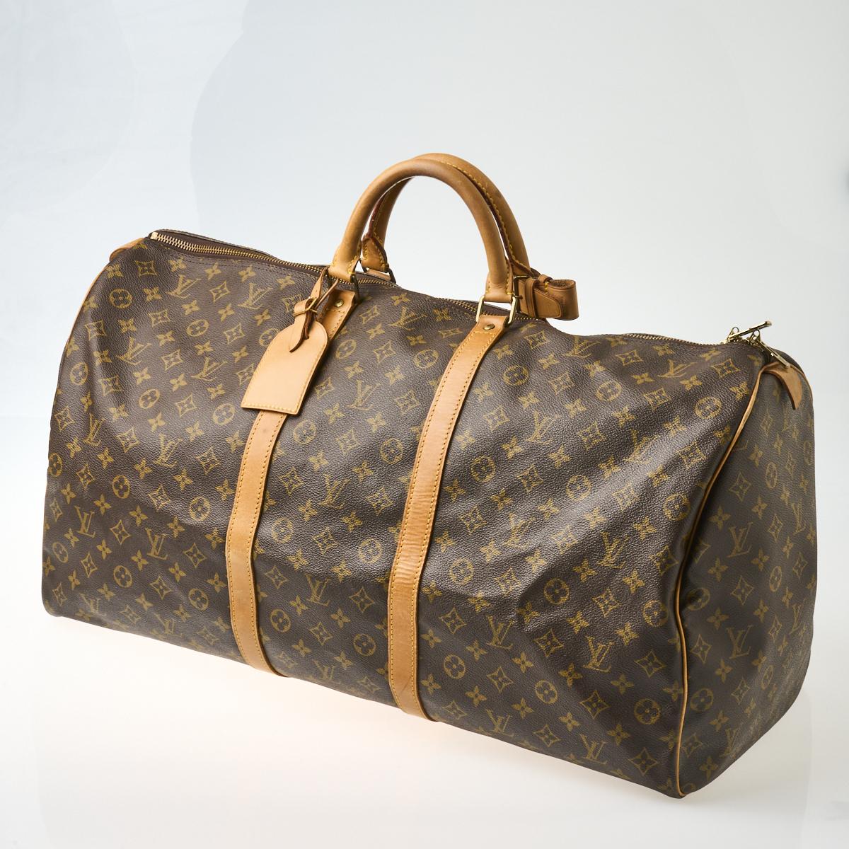 Lot - A Louis Vuitton monogram canvas suit carrier 60 with Vachetta leather  handle and trim, gold tone hardware