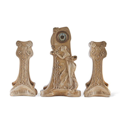 An Art Nouveau Figural Clock and Garnitures