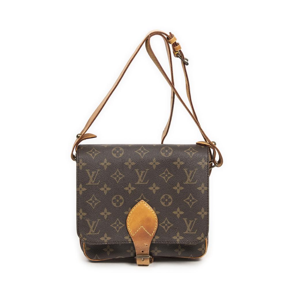 At Auction: A Louis Vuitton Monogram Cartouchiere Crossbody Bag.