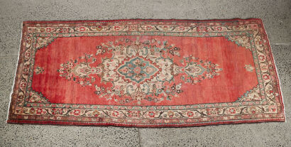 A Hand Knotted Iranian Wool Rug