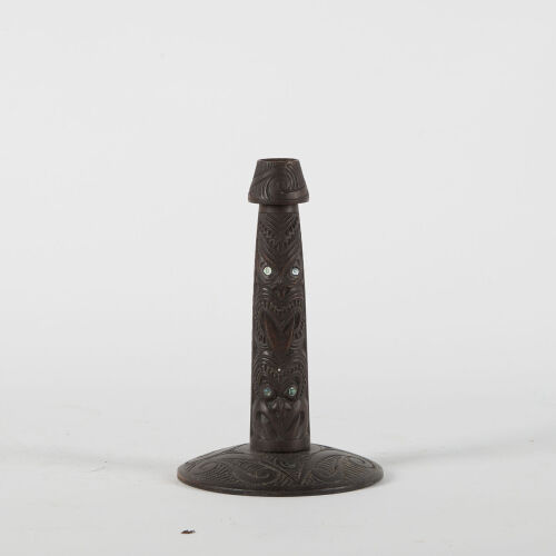 A Carved Souvenirware Candle Stick Holder