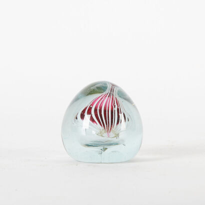 An Earthworks Glass Paper Weight