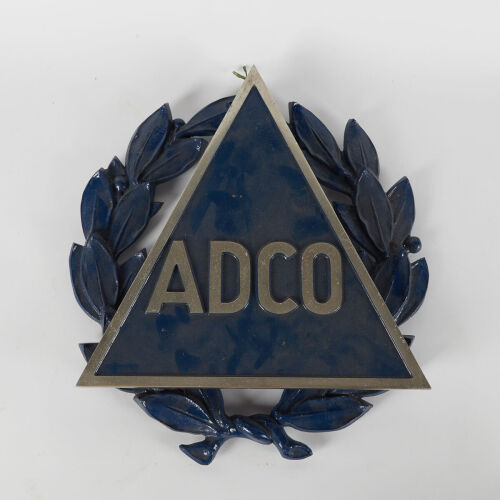 A Metal Adco Wall Plaque