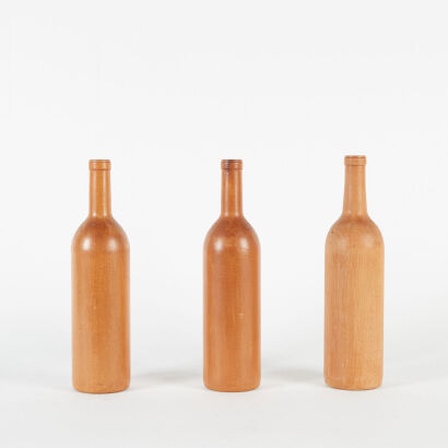 A Set Of Three Rimu Wine Bottles