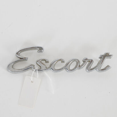 A Vintage Ford Escort Car Badge