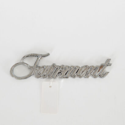 A Vintage Ford Fairmont Car Badge