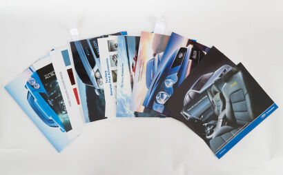 A lot of 12 Ford Sales Brochures