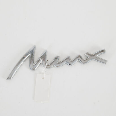 A Vintage Hillman Minx Car Badge