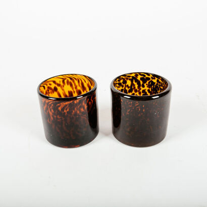 A Pair Of Tortoiseshell Glass Candle Holders