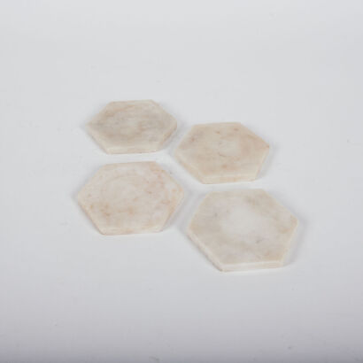 A Set Of Four Hexagonal Marble Coasters