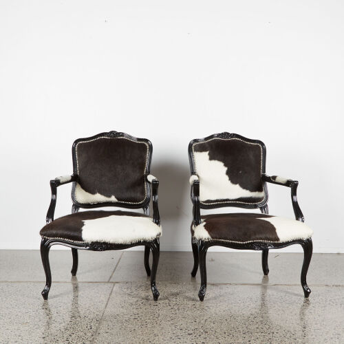 A Pair Of Louis Black Lacquer And Cow Hide Occasional Chairs