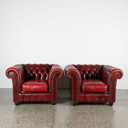 A Pair Of Leather Chesterfield Chairs