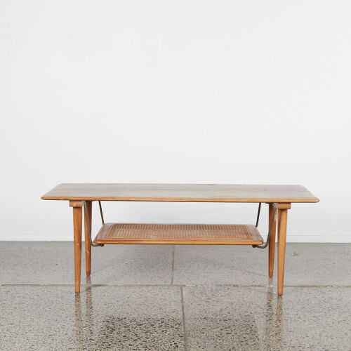 A Mid-Century Coffee Table With A Ratan Magazine Shelf