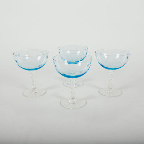 A Set Of Four Blue Etched Star Coupes