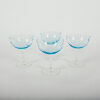 A Set Of Four Blue Etched Star Coupes