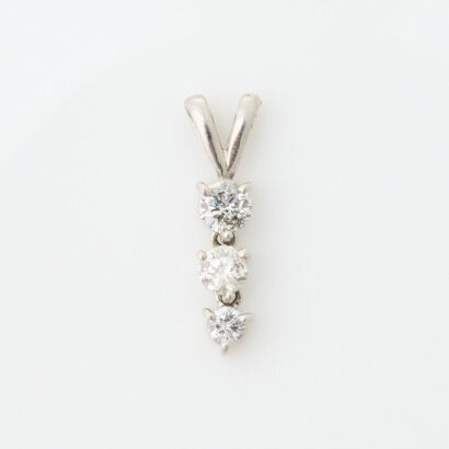 Platinum three Stone Diamond Pendant. TDW .50 carats
